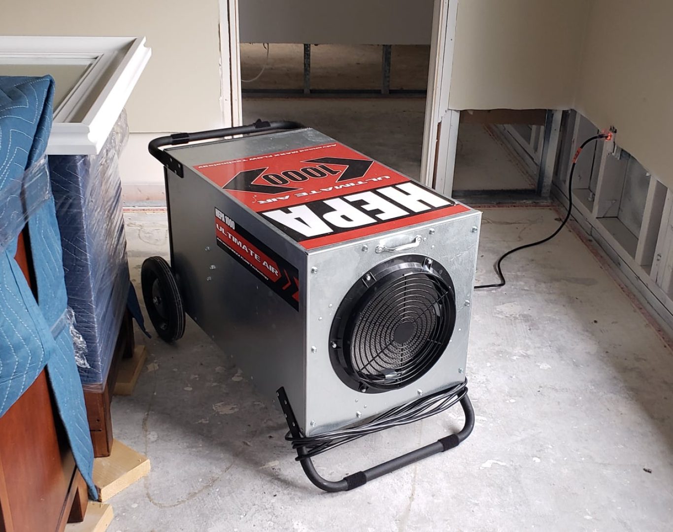 Water Damage Restoration Near Me, Technicians removing mold-damaged drywall in Palm Beach waterfront bedroom after storm leak